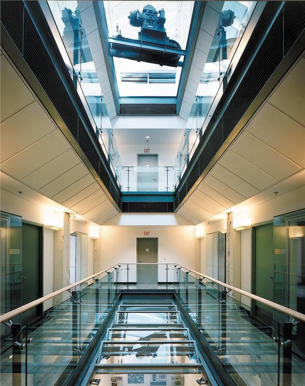 In 1998, Busby + Associates Architects with Robert Lemon Architecture & Preservation retrofitted a downtown newspaper printing press building into the AIBC's headquarters. The architects added a central atrium to provide natural light and ventilation to all three office levels.