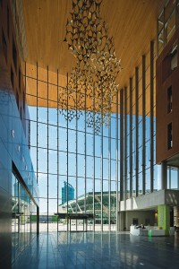 The soaring atrium of Surrey City Hall flows into the adjacent plaza. Both are generously proportioned for flexible uses in festivals, performances, and other community events.