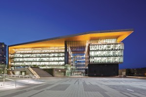 Creating a bold identity, the building appears to be wrapped by a single sheet of Douglas fir-lined concrete.