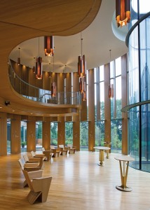 The chapel draws from the tectonic language of Shim-Sutcliffe's Integral House, employing full-height vertical white oak louvres and suspended light fittings.