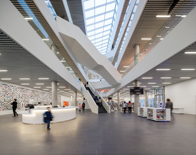 Dynamic staircases crisscross above the central atrium.