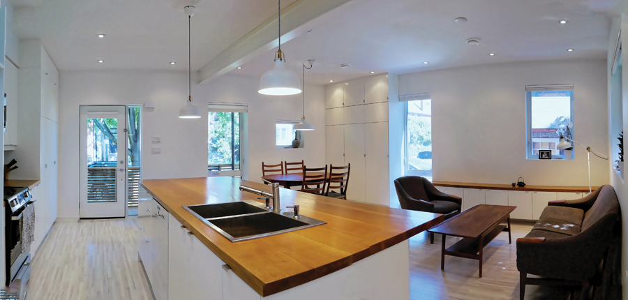 An open plan maximizes usable space in the compact home. Photo by Carla Weinberg