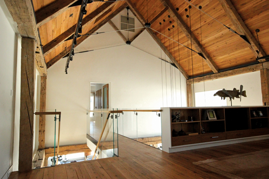 View of the bridge leading to the den on the second floor.