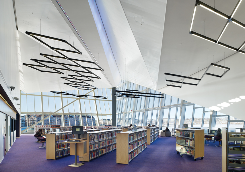 The library occupies the prow of the building, and is distinguished by its folded ceiling plane. Photo by Tom Arban