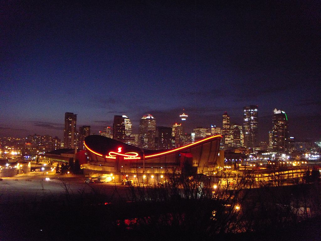 The night skyline frames the Calgary Saddledome. Photo by JMacPherson