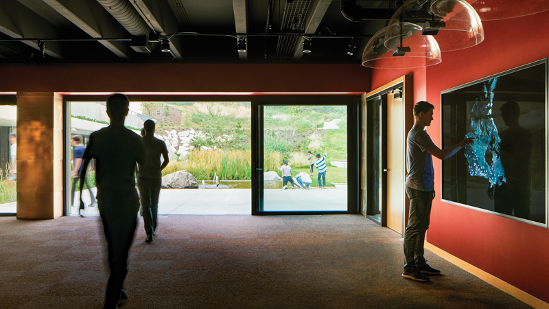 An exhibition space called the Vault of Memories includes a map of Canada’s 132 residential schools, with linked videos, photos and survivor testimonials. Sliding glass doors open the room up to a ceremonial plaza bordered by a storm water wetland.