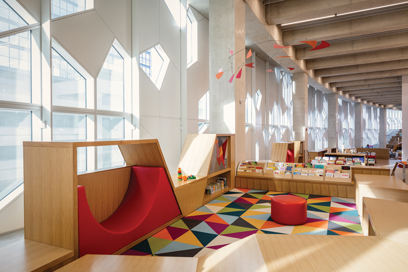 The childrenÕs library cascades down several levels, creating a variety of areas for playtime and storytime with smaller groups.