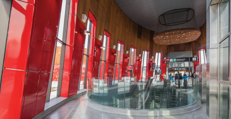 The Pioneer Village Station interior includes a bespoke luminaire that resembles a boulder embedded with glowing gemstones.