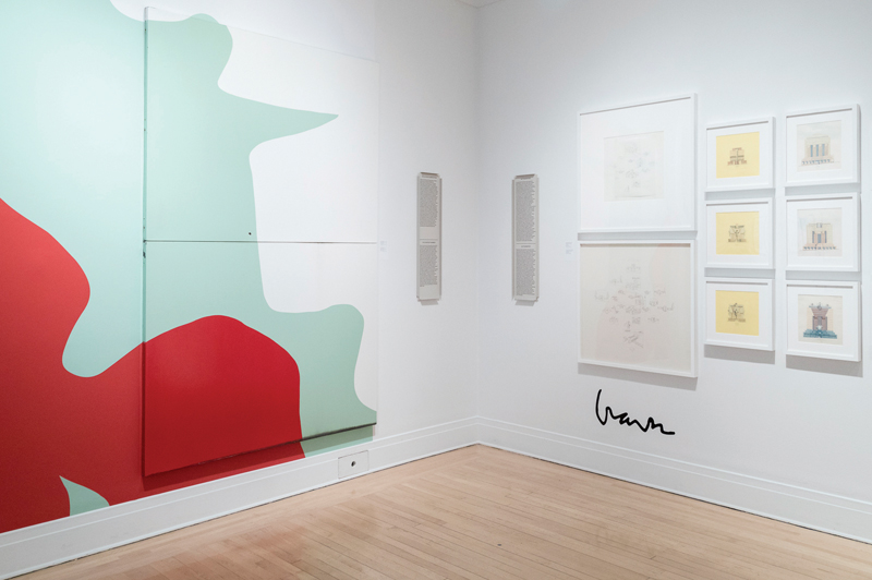 A selection of Michael GravesÕ hand drawings is accompanied by an oversized signature on the wall. Graves often used tracing paper to expediently copy his own work, in order to satisy the enormous market demand for his personal drawings