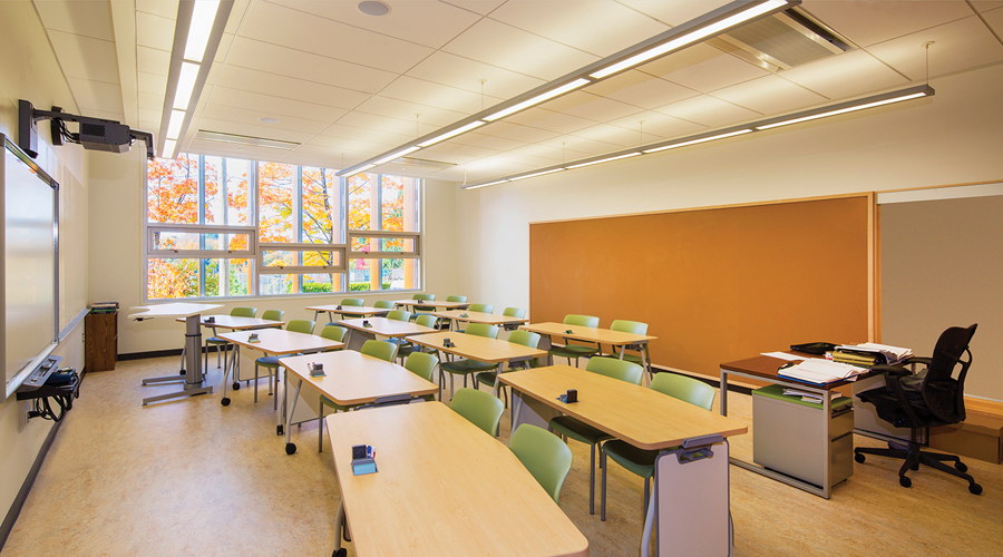 A typical classroom equipped with operable windows, smartboard and tackboard back wall.