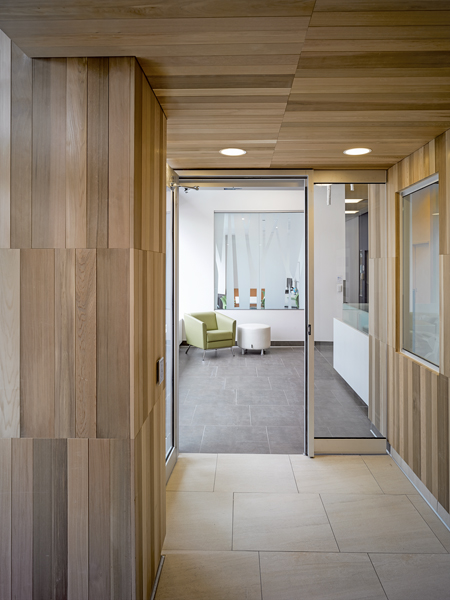A cedar-clad entrance welcomes expectant mothers.