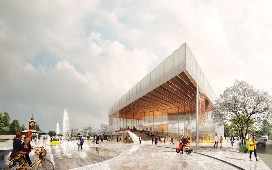 A large wood canopy extends over the plaza of the future performance hall.