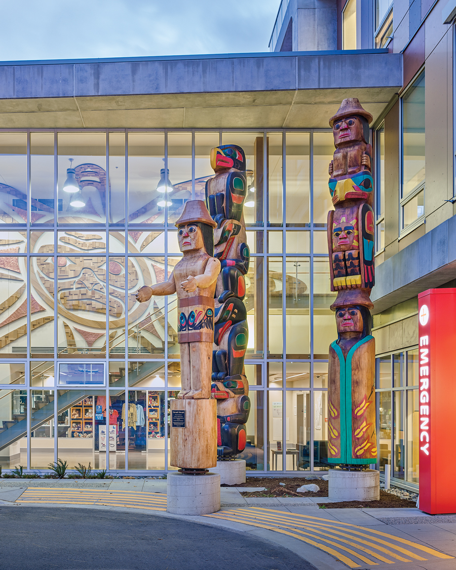 Totem poles crafted by local artisans greet patients and visitors at the entrance to the new hospital addition.