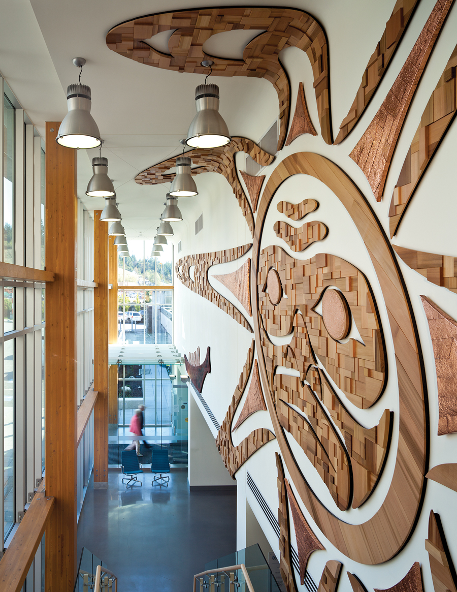 A wood mural in the main lobby references traditional motifs from the local First Nations band.