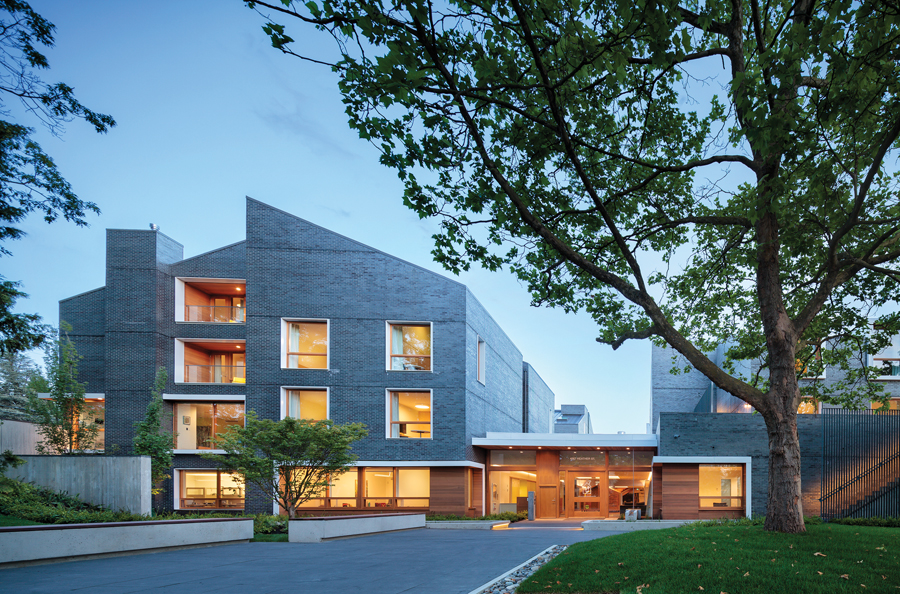 Vancouver’s Ronald McDonald House is built using tilt-up CLT wood panels. The exterior is clad with grey iron-spot brick, complementing the residential forms and materials of the surrounding neighbourhood. (Photo: Ed White)