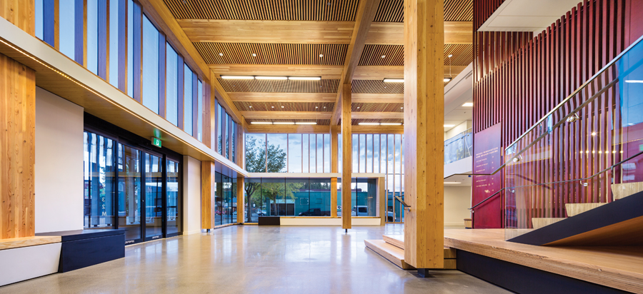 Throughout the facility, thickened columns and beams allow for a degree of inherent fire resistance, because large timber elements char at a slow and predictable rate. The charred layer serves to insulate the relatively cool core, allowing each member to continue carrying the required structural load to achieve a one-hour fire resistance rating.
