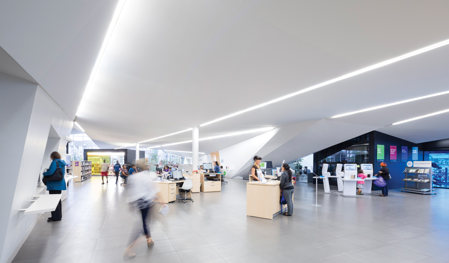 Instead of permanent circulation desks, librarians work from desks that can be moved around the space in different configurations.