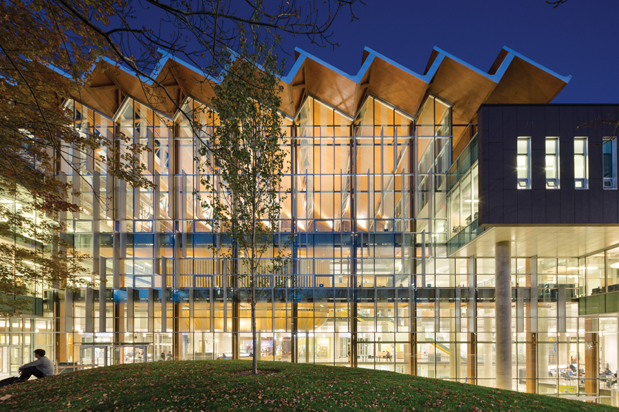 Next door to the alumni centre, the sawtoothed roof of the AMS Nest student centre rises above a grassy knoll. A central element in the design, the knoll was preserved from the existing site as a longstanding symbol of student protest at UBC. Photo: Ema Peters