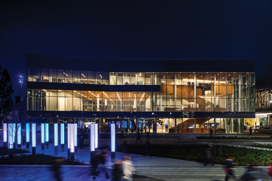 Fritted with a fine pattern of white lines, the façade protects against glare while showcasing the alumni centre’s evening lectures and networking events. Photo: Nic Lehoux
