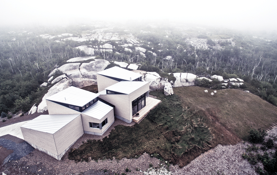 Situated atop a hill in Purcell’s Cove, Float is surrounded by exposed bedrock and the remnants of a dense forest that was devastated by fire.