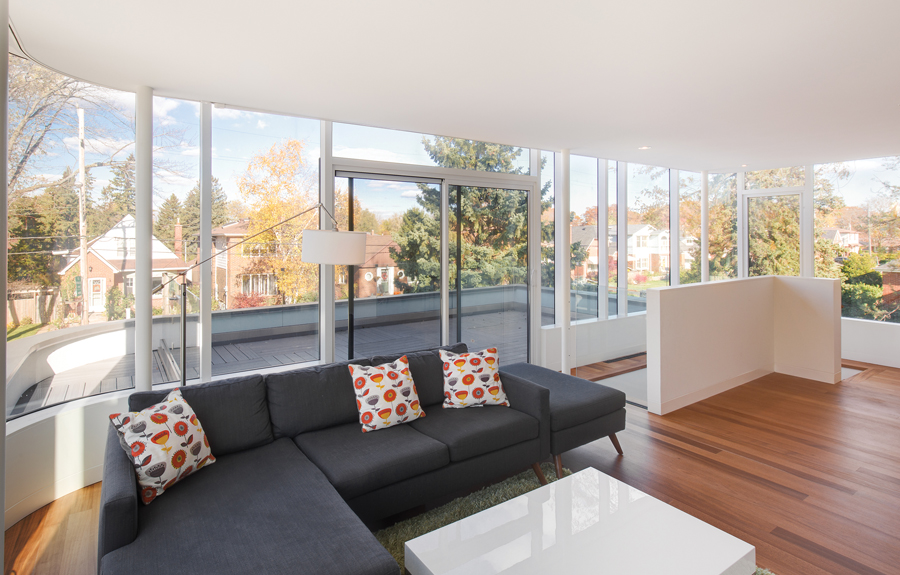 The second floor family room opens onto an outdoor terrace and enjoys treetop views of the surrounding neighbourhood.