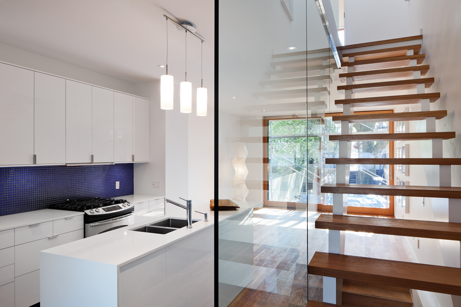 A vocabulary of repeatable elements was established in House 1, including open-riser stairs flanked by a glass wall.