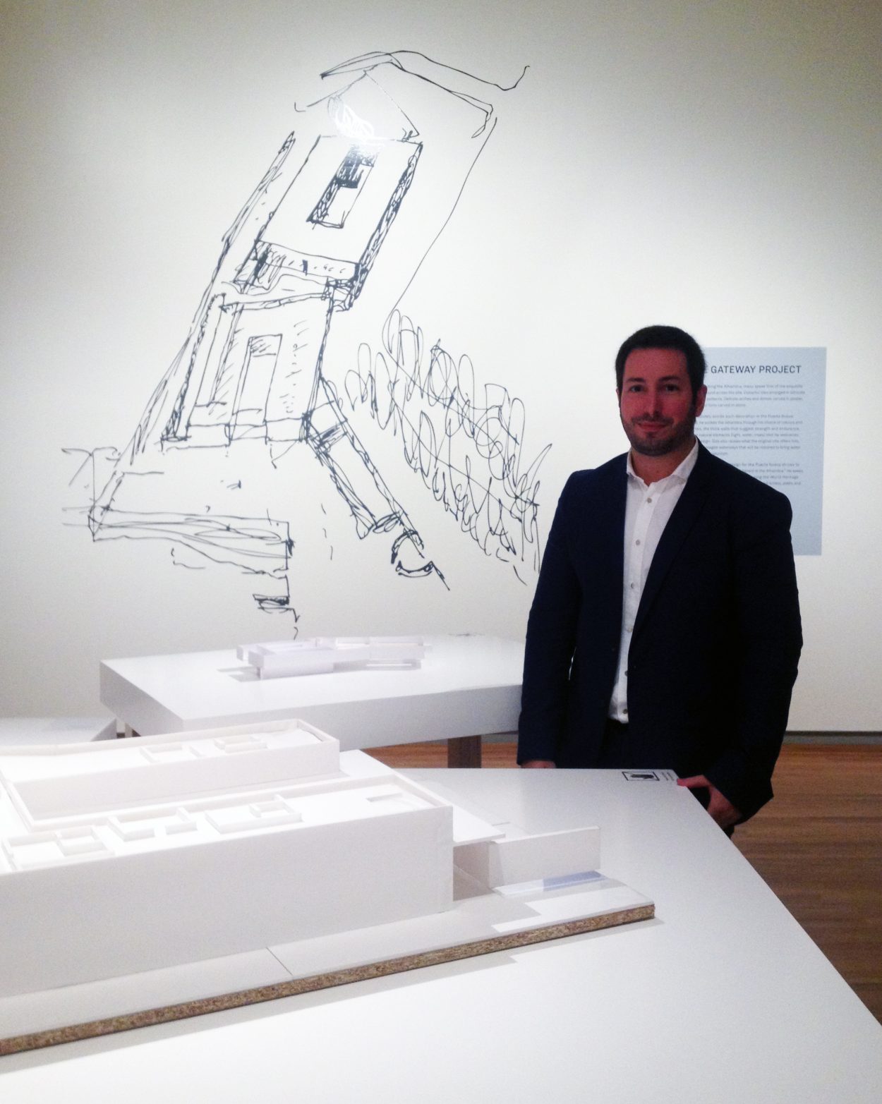 Curator António Choupina alongside a sectional model of the Alhambra visitors' centre created for the exhibition.