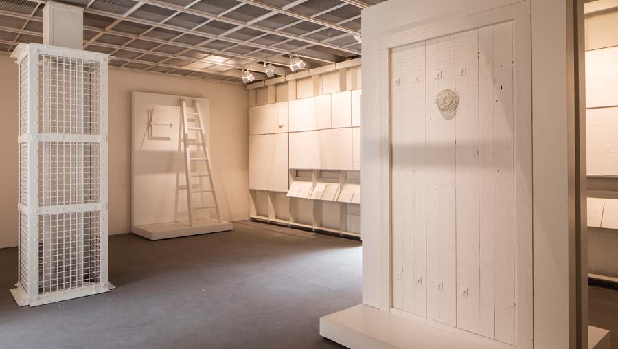 Reproductions of a gas-tight hatch,
a door with a protected peephole, and a column for lowering gas pellets present architectural evidence for the killing chambers
at Auschwitz.