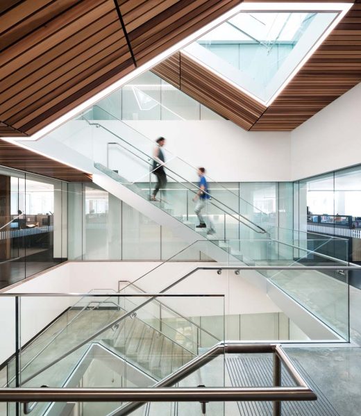 A skylit atrium in the main office building brings natural light through the floorplate and visually connects various departments.