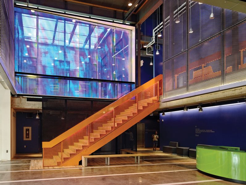 Made from dichroic glass, an art installation by Hal Ingberg brings a rainbow of iridescent tones to the main entry area. The piece adjoins an upper terrace, which acts as spillover space for the second floor theatre lobby.