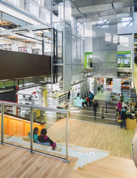 Exposed structure and a layered use of translucent materials contribute to the assemblage-like composition, lending a lively atmosphere to the library.