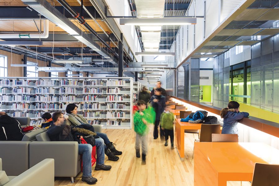 The exposed structure allows natural light to fill the library.