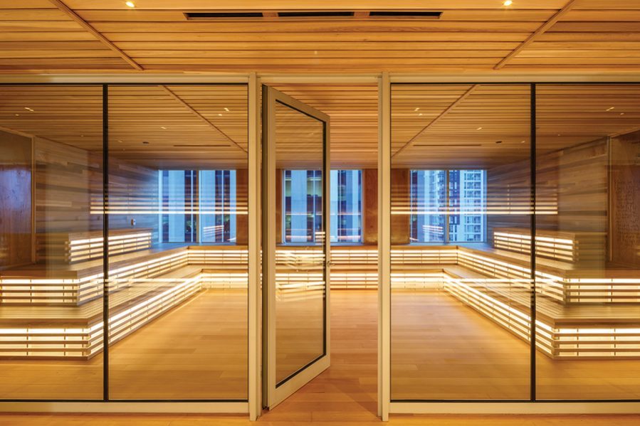 A wood-lined meeting space with tiered seating conveys the relaxed feel of a giant sauna. Photo by Doublespace Photography