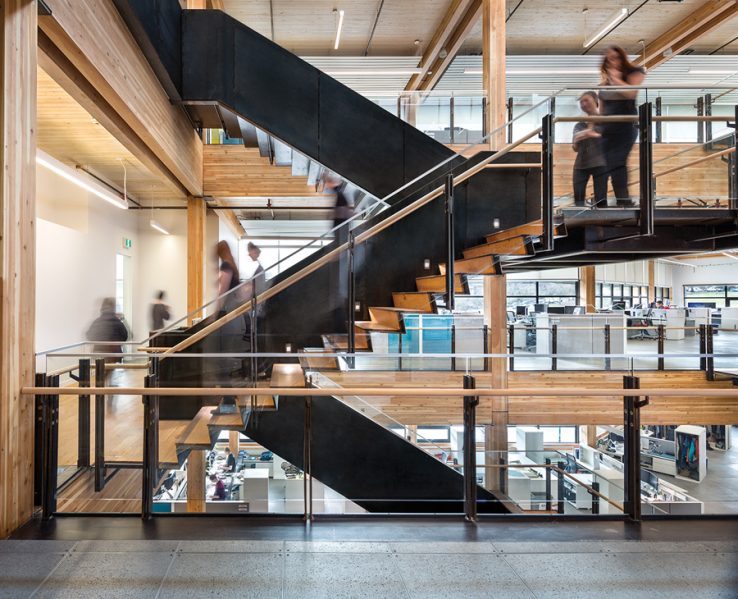 The interior uses a heavy timber structure and includes a feature stair that links between workgroups. Photo by Ed White Photographics