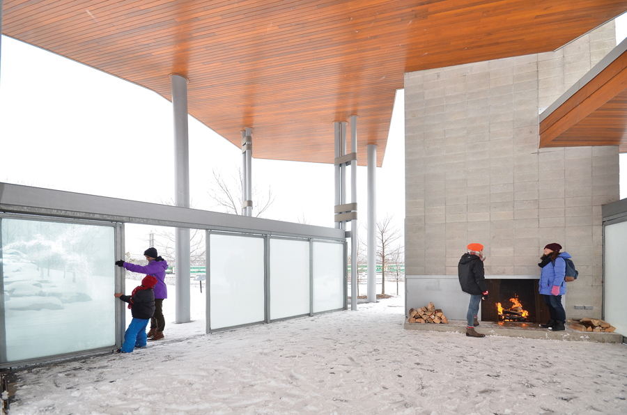 Sliding doors can be pulled close to block wind and snow. A fireplace allows the pavilion to act as a cozy shelter in the winter months and on cool evenings in the shoulder seasons.