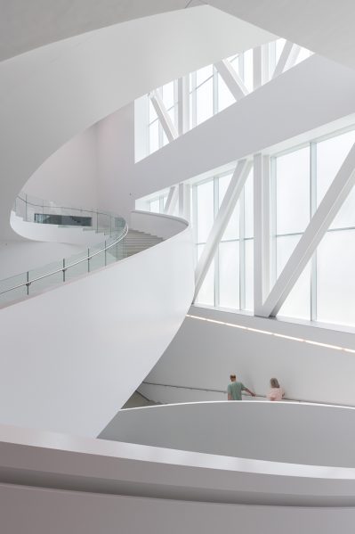 A sculptural stair connects the lower three levels. Photo by Iwan Baan