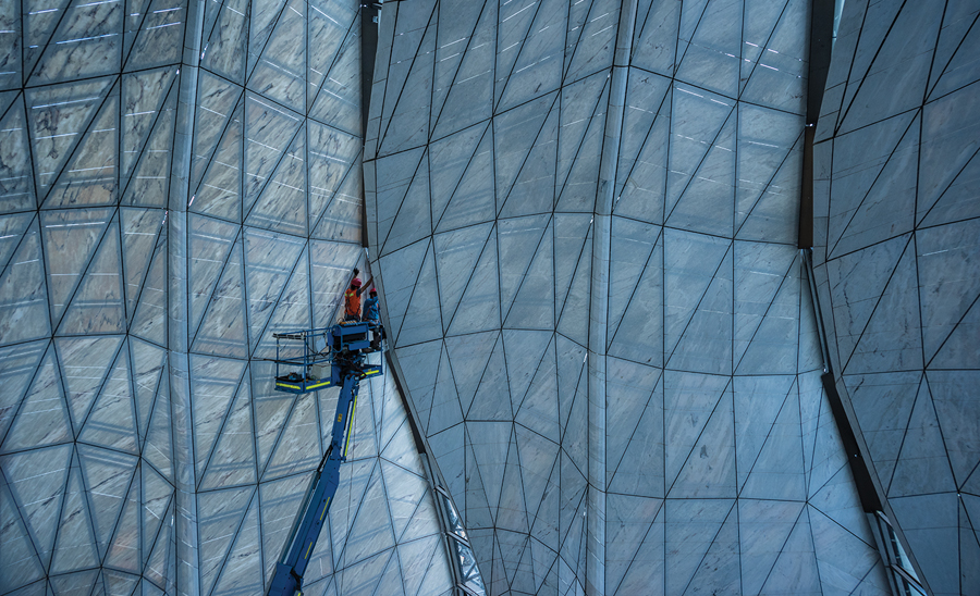 The materiality and faceted geometry of the temple’s interior and exterior skins captures the diverse qualities of natural daylight in Chile’s capital city. Photo: Guy Wenborne