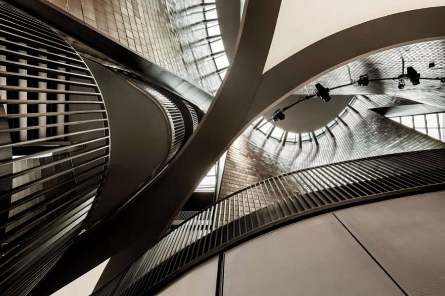 A view looking up from the performance hall provides glimpses of the rich spatial layering.