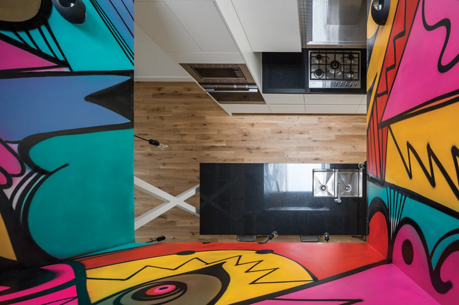 Graffiti-like murals by a local artist adorn the light court in the upper unit.