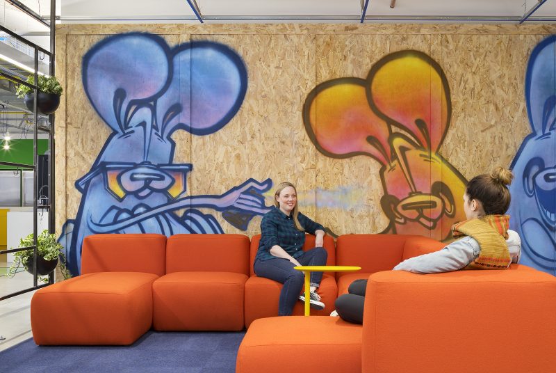 When the client is a travel booking website company, a travel-themed vibe is only natural. Gensler designed this tech company’s Toronto office as a city within a city, a “Downtown/Out of Town” concept which mixes known Toronto urban traits (local graffiti artists were retained to create original artwork on the premises) contrast cottage country living (mock cabin using reclaimed wood planks with modern Muskoka chairs). Photo by Tom Arban