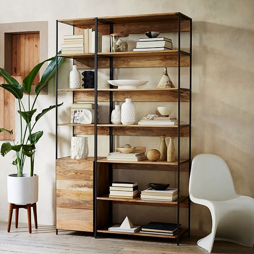 Backward books make an appearance in the West Elm catalogue. Image via West Elm.