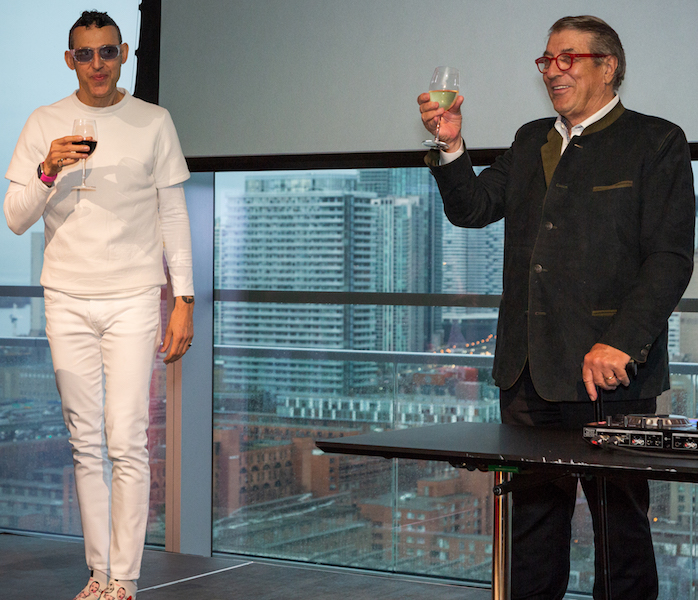 Toronto-born design superstar Karim Rashid, wearing his trademark whites, and Klaus Nienkamper raise a toast after giving brief speeches.