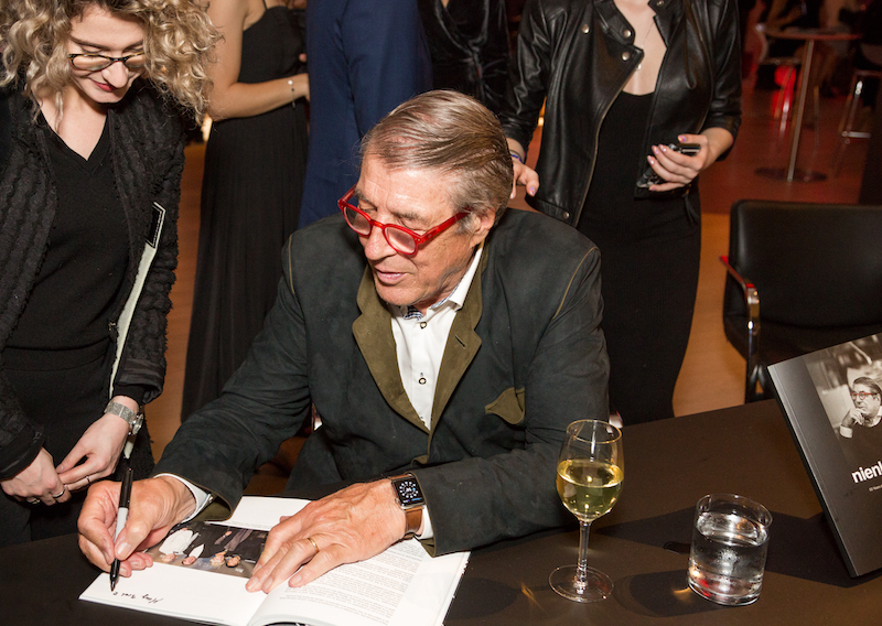 Klaus at the book-signing table, where each Nienkamper-branded goodie bag held a copy, hot off the press, of Nienkamper: 50 Years of Excellence from Design to Delivery.