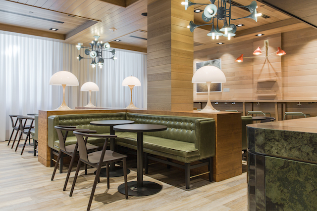Eve Café, the first café of its kind for major retailer La Maison Simons, has nod to French style and charm with an injection of rich, textural finishes and residential-inspired accents that creates an entirely different experience from shopping. With subtle retro influences, McKinley Burkart settled on a restrained palette of simple, unassuming materials like wood panelling and black marble tile for the third instalment of the Village Ice Cream brand.