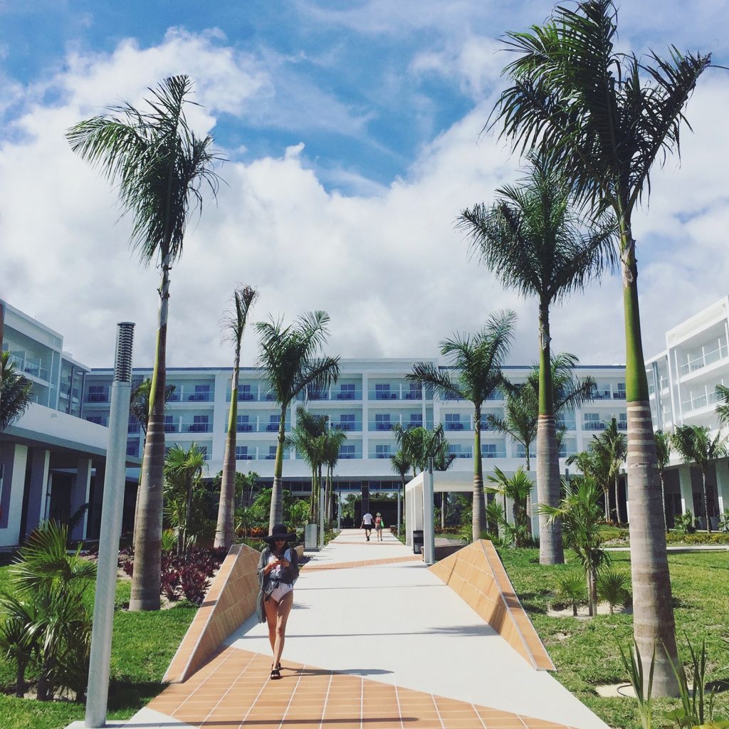 A woman walking along a path at Riu Dunamar