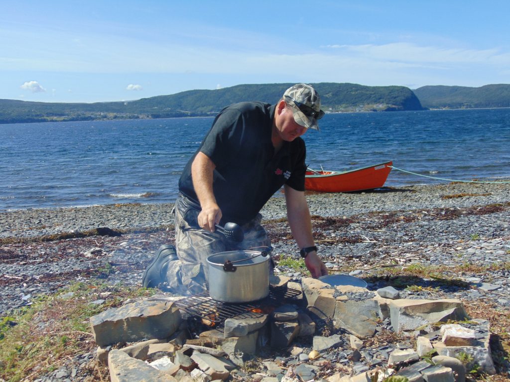 Four Seasons Tours’ Darren Park cooks mussels on a Bay of Islands beach