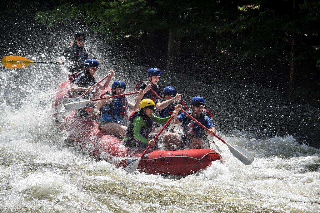 A group of people whitewater rafting in New Hampshire