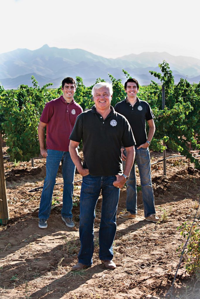 A portrait of Bob Carlson and his two sons