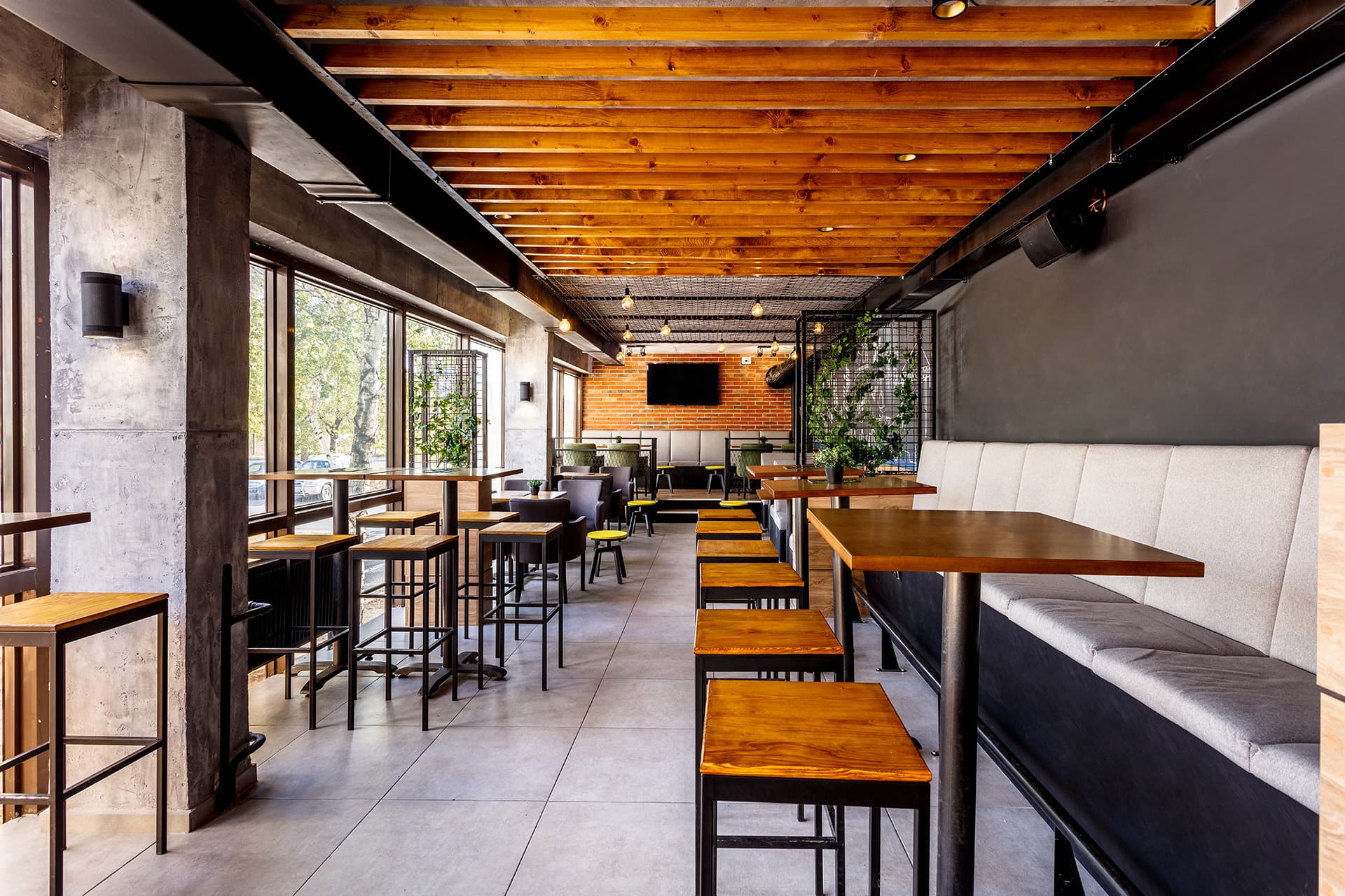 Empty restaurant with wooden seats inside a hotel with hospitality insurance