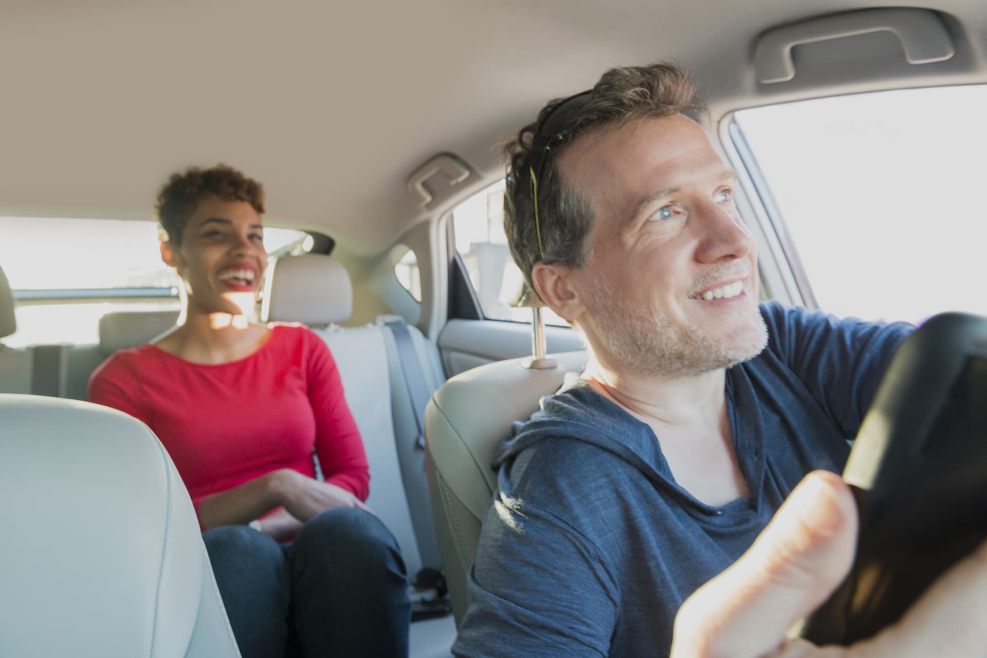 Ride-sharing insurance for male driver with female passenger in the back of his car